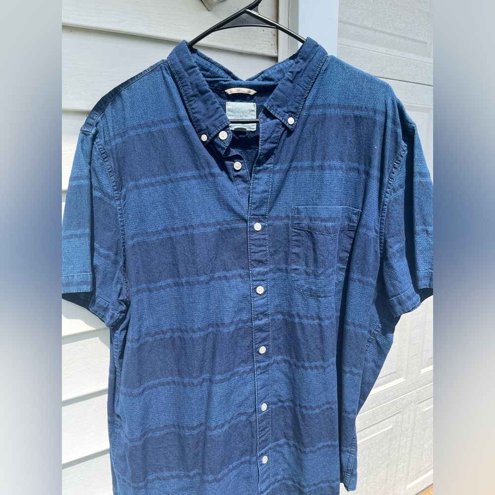 blue and navy striped button down collared shirt